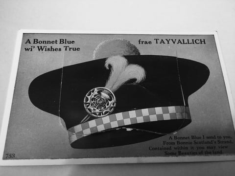 Black and white vintage illustration of a Scottish bonnet with feather plume and checkered band, with text about wishes and Scottish tartan